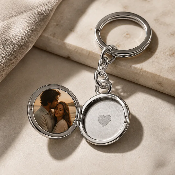Round silver locket keychain holding a custom photograph
